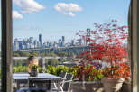 Experience breathtaking city and water views from this stunning property's expansive balcony.