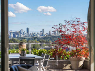Experience breathtaking city and water views from this stunning property's expansive balcony.