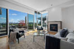 Experience luxurious living with this stunning condo featuring expansive floor-to-ceiling windows that offer breathtaking city and water views.
