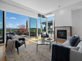 Experience luxurious living with this stunning condo featuring expansive floor-to-ceiling windows that offer breathtaking city and water views.
