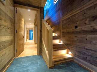 Experience rustic charm and modern comfort in this beautifully appointed chalet hallway.