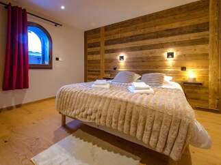 Experience rustic charm and modern comfort in this beautifully appointed bedroom.
