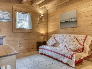 This cozy living area features a charming wooden interior, perfect for a mountain retreat.