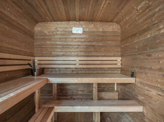 Experience ultimate relaxation in this beautifully crafted wooden sauna.
