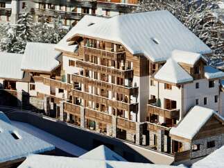 Experience luxury mountain living in this stunning chalet, featuring a modern design with traditional alpine charm.