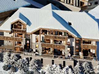 Experience luxury mountain living in this stunning chalet, featuring expansive balconies with breathtaking snowy vistas.