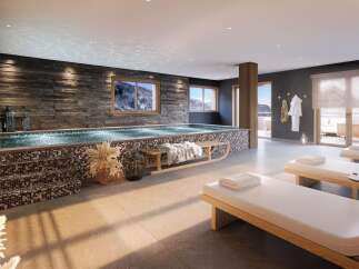 Experience ultimate relaxation in this luxurious spa featuring a stunning indoor pool with a mosaic tile accent and a stone feature wall.