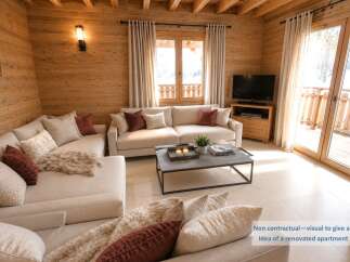 Experience modern mountain living in this beautifully renovated apartment, featuring a spacious sectional sofa adorned with plush throw pillows and a cozy rug.