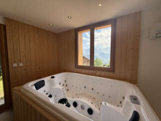 Indulge in ultimate relaxation in this luxurious bathroom featuring a spacious jacuzzi tub.