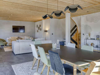 Experience modern mountain living in this spacious open-concept dining and living area.