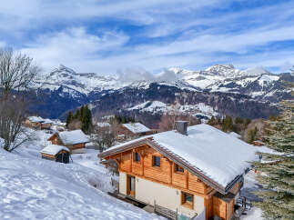 Experience the ultimate alpine lifestyle in this charming wooden chalet, nestled amidst a picturesque snow-covered landscape.