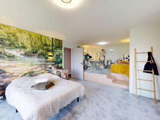 Immerse yourself in nature with this uniquely designed bedroom featuring a stunning forest waterfall mural.