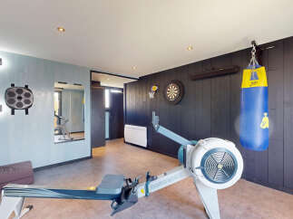 Transform your home into a personal fitness sanctuary with this dedicated gym space.