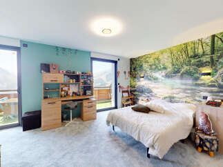 Experience breathtaking mountain views from this unique bedroom featuring a stunning forest mural.
