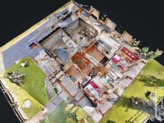 Discover this spacious property featuring two garages, perfect for vehicle storage or a workshop.