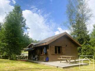 Experience serene mountain living in this charming wooden cabin, perfect for a cozy getaway.