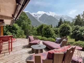Experience breathtaking mountain views from this stunning outdoor living space.