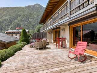 Enjoy breathtaking mountain views from this spacious wooden deck, perfect for outdoor living and entertaining.