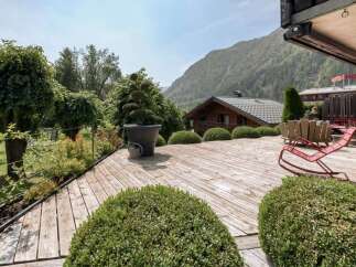 Enjoy breathtaking mountain views from this expansive wooden deck, perfect for outdoor entertaining or quiet relaxation.