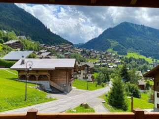 Experience the charm of alpine living in this picturesque village nestled amidst lush green mountains.