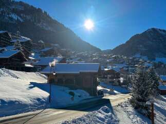 Experience the charm of a winter wonderland with this stunning alpine village scene.
