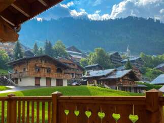 Experience the charm of alpine living in this stunning chalet-style property nestled amidst breathtaking mountain scenery.