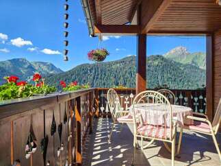 Enjoy breathtaking mountain views from this charming balcony, perfect for morning coffee or evening relaxation.