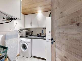Discover this compact and functional laundry room, perfect for any home.
