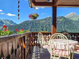 Enjoy breathtaking mountain views from this charming balcony, perfect for your morning coffee or evening relaxation.