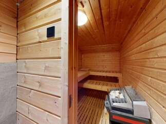 Experience ultimate relaxation in this beautifully crafted wooden sauna.