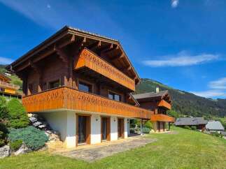 Experience the charm of alpine living in this stunning wooden chalet, nestled amidst breathtaking mountain scenery.