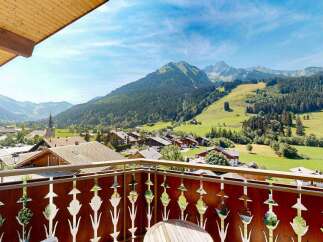Experience breathtaking mountain views from this charming balcony, perfect for enjoying your morning coffee or evening wine.