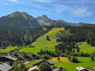 Experience the charm of alpine living in this picturesque village nestled at the foot of majestic mountains.