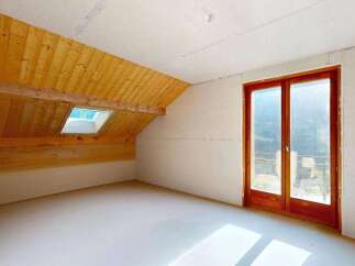 Discover this unfinished attic space, perfect for customization.