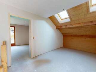 Discover the potential of this unfinished attic space, perfect for customization.