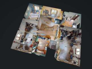 Discover this multi-level property featuring a cozy apartment with a bedroom and a combined living room/kitchen area.