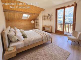 Experience the charm of this mountain retreat, featuring a cozy bedroom with a wooden sloped ceiling and a skylight for natural light.