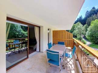 Enjoy breathtaking mountain views from this charming balcony, perfect for al fresco dining or morning coffee.