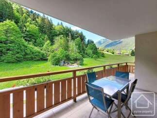 Enjoy breathtaking mountain views from this charming balcony, perfect for al fresco dining or morning coffee.