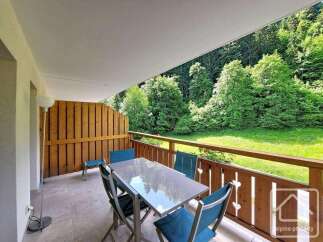 Enjoy the serene mountain views from this charming balcony, perfect for outdoor dining or relaxation.