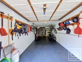 This spacious garage offers ample storage solutions for your outdoor gear and vehicles.