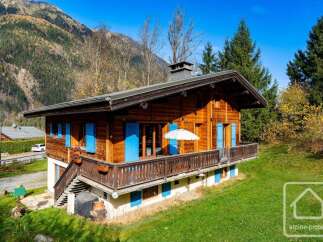 Experience the charm of this rustic wooden chalet nestled amidst breathtaking mountain scenery.