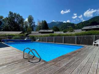 Enjoy a refreshing dip in this stunning outdoor swimming pool, perfect for relaxation and fun.