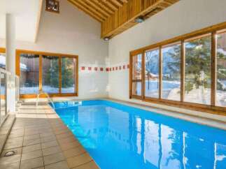 Escape to this indoor swimming pool, offering a refreshing dip regardless of the weather outside.