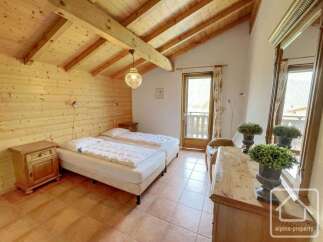 This charming bedroom features two comfortable beds, perfect for a cozy retreat.
