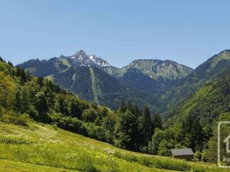 Discover this charming property nestled in a picturesque mountain landscape, offering breathtaking views of snow-capped peaks and lush green valleys.