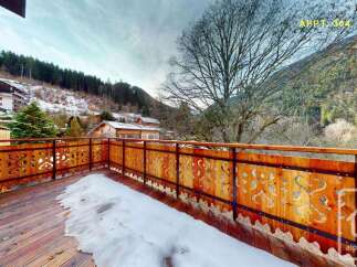 Enjoy breathtaking mountain views from this charming balcony, perfect for savoring your morning coffee or evening wine.