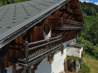 Experience rustic charm in this traditional wooden chalet, featuring multiple balconies perfect for enjoying mountain views.