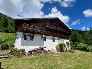 Experience rustic charm in this traditional wooden chalet nestled in a serene mountain landscape.