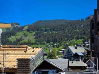 Experience the charm of alpine living with this stunning property nestled amidst breathtaking mountain scenery.